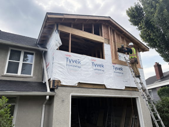 Second-story home addition being framed above an existing garage in the East Bay